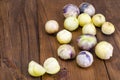 Ripe tomatillo Physalis, Mexican husk tomato on wooden table