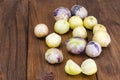 Ripe tomatillo Physalis, Mexican husk tomato on wooden table Royalty Free Stock Photo