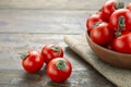 Ripe tomatoes in a clay plate