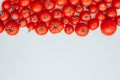 Ripe tomatoes of different size pattern on white background with copy space. Organic vegetables. Royalty Free Stock Photo