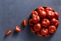 Ripe tomatoes on grey background