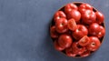 Ripe tomatoes on grey background