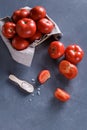 Ripe tomatoes on grey background