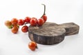 Ripe tomatoes on lie on a cutting board on a white background,, Royalty Free Stock Photo