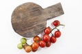 Ripe tomatoes on lie on a cutting board on a white background,, Royalty Free Stock Photo