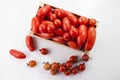 Ripe tomatoes on lie in a wooden box on a white background,, Royalty Free Stock Photo