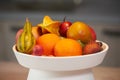 Ripe tropical fruits in a white dish