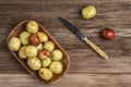 Ripe and unripe jujube fruit on cutting board on wooden table Royalty Free Stock Photo