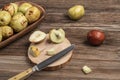 Ripe and unripe jujube fruit on cutting board on wooden table Royalty Free Stock Photo