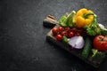 Ripe vegetables. Fresh vegetables on black stone background. Tropical fruits. Top view. Royalty Free Stock Photo