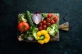 Ripe vegetables. Fresh vegetables on black stone background. Tropical fruits. Top view. Royalty Free Stock Photo