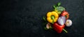 Ripe vegetables. Fresh vegetables on black stone background. Tropical fruits. Top view. Royalty Free Stock Photo