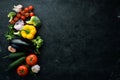 Ripe vegetables. Fresh vegetables on black stone background. Tropical fruits. Top view. Royalty Free Stock Photo