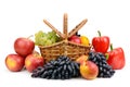 Ripe vegetables and fruits in willow basket isolated on white Royalty Free Stock Photo
