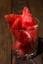 Ripe watermelon cut into pieces in a glass for whiskey