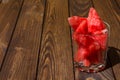 Ripe watermelon cut into pieces in a glass for whiskey