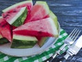 Ripe watermelon piece, plate snack summer organic dessert on a black wooden background natural Royalty Free Stock Photo