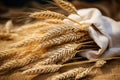 Ripe wheat ears on peasants table - symbol of plentiful harvest and agricultural prosperity