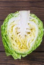Ripe white cabbage on a wooden table. Top views, close-up