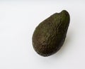 Ripe whole avocado on white background