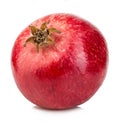 Ripe whole pomegranate close-up isolated on a white background.