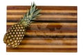 Ripe whole tropical pineapple on a cutting board