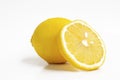Ripe whole yellow lemon citrus fruit with lemon fruit half isolated on white background Royalty Free Stock Photo
