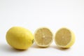 Ripe whole yellow lemon citrus fruit with lemon slice isolated on white background with clipping path. Royalty Free Stock Photo