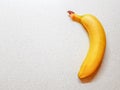 Ripe yellow banana on the white marble table