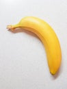 Ripe yellow banana on the white marble table