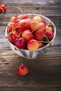 Ripe yellow cherries in wooden bowls Royalty Free Stock Photo