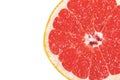Ripe, yellow grapefruit cut in half, resting on a white plate Royalty Free Stock Photo