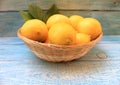 Ripe yellow lemons in a basket