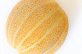 Ripe yellow melon close up on white background, texture pattern of the rind Royalty Free Stock Photo