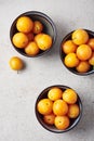 Ripe yellow mirabelle plums in bowls