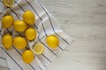 Ripe Yellow Organic Lemons on a white wooden background, overhead view. Flat lay, top view, from above. Copy space Royalty Free Stock Photo