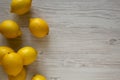 Ripe Yellow Organic Lemons on a white wooden background, top view. Flat lay, overhead, from above. Copy space Royalty Free Stock Photo