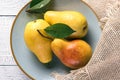 Ripe yellow pears on blue plate Royalty Free Stock Photo