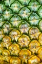 Ripe yellow pineapple skin texture closeup