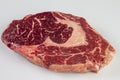 Ripened seasoned beef rib eye or entrecote steak on white background