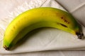 RIPENING BANANA ON A WHITE NAPKIN