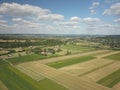 Ripening grain harvest in wheat fields from a bird`s eye view. Mechanization of agricultural labor. The farm is a source of food.