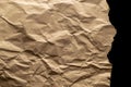 Ripped craft paper. Torn kraft paper texture background. Old craft vintage cardboard isolated on black with clipping Royalty Free Stock Photo