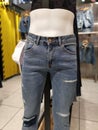 Ripped denim pants at fashion store