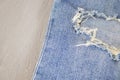 Ripped destroyed in wash blue denim jeans. isolated background Royalty Free Stock Photo