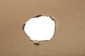 Ripped hole in cardboard on white background with clipping path Royalty Free Stock Photo