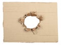 Ripped hole in cardboard package. Isolated