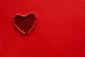 Ripped paper hole heart shaped on red paper background. Valentine`s day celebration concept Royalty Free Stock Photo