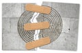 Ripped photo of a labyrinth carved on stone wall of a romanesque church - solution repairing concept with adhesive bandage