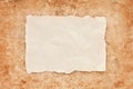 Ripped piece of old paper on grunge background Royalty Free Stock Photo